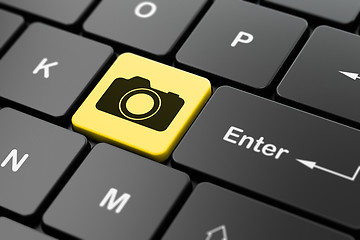 Image showing Tourism concept: Photo Camera on computer keyboard background