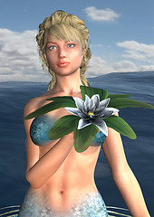 Image showing Mermaid holding Water Lily