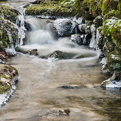 Image showing Small creek with a waterfall close up