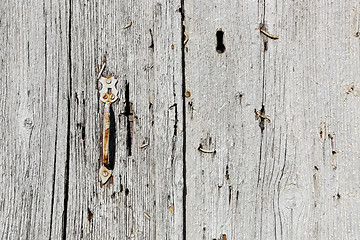 Image showing Very old wooden door with handle