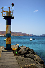 Image showing spain lighthouse and harbor pier boat in the 