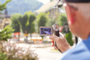 Image showing elderly man with video camera