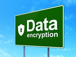 Image showing Protection concept: Data Encryption and Shield With Keyhole on road sign background
