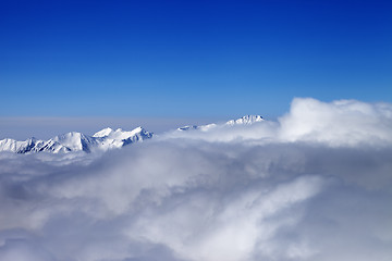 Image showing Mountains in clouds at nice sun day