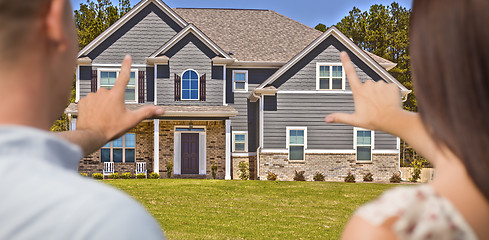 Image showing House and Military Couple Framing Hands in Front