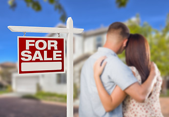 Image showing For Sale Real Estate Sign, Military Couple Looking at House