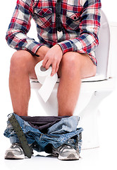 Image showing Man on toilet bowl