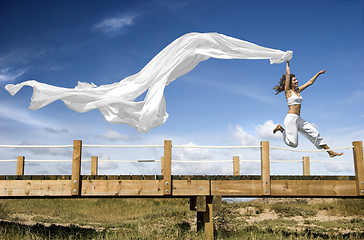 Image showing Jumping with a scarf