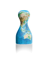 Image showing Wooden pawn with a painting of a map