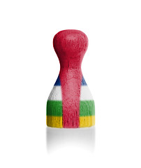 Image showing Wooden pawn with a painting of a flag