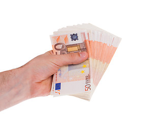 Image showing Many 50 euro bills in a hand