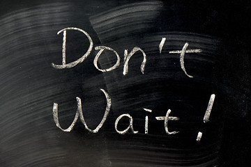 Image showing Don't Wait - words written on a blackboard