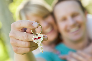 Image showing Couple Holding House Key with Home Text