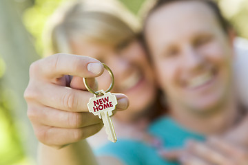 Image showing Couple Holding House Key with New Home Text