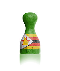 Image showing Wooden pawn with a flag painting