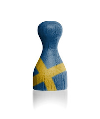 Image showing Wooden pawn with a flag painting