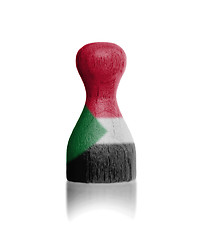 Image showing Wooden pawn with a flag painting