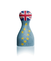 Image showing Wooden pawn with a flag painting