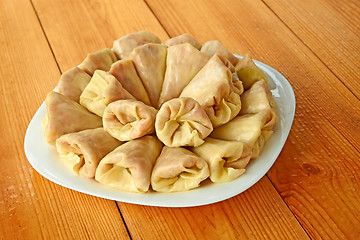 Image showing Stuffed cabbage rolls on the wooden table