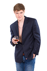 Image showing Young man posing with a glass of whiskey