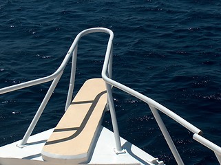 Image showing Boat with a white bow and broken railing