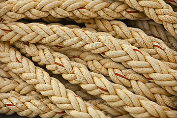 Image showing Nautical knots. Big marine vintage sea ropes in heap background