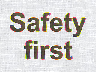 Image showing Protection concept: Safety First on fabric texture background