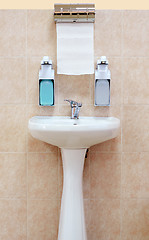 Image showing Washbasin with a paper towel and liquid soap