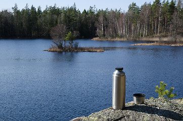 Image showing Thermos by forest lake side