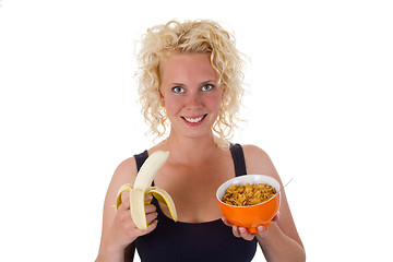 Image showing Young woman with banana and cornflakes