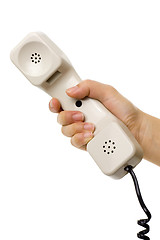 Image showing Hand holding a telephone handset


