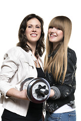 Image showing Two women with silver dumbbell