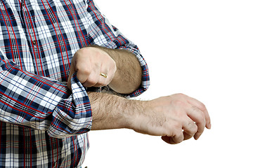 Image showing Man rolls up sleeves