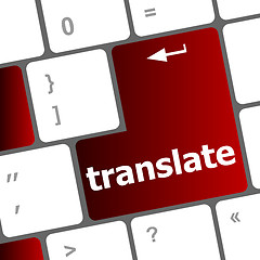 Image showing Multilingual translation on-line concept. Close up of multi language keyboard and translate word key