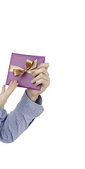 Image showing Young man holding a present