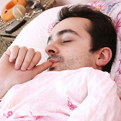 Image showing Young man sleeping .