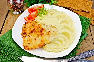 Image showing Fish fried with mashed potatoes on napkin