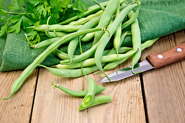 Image showing Beans green on the board with a knife