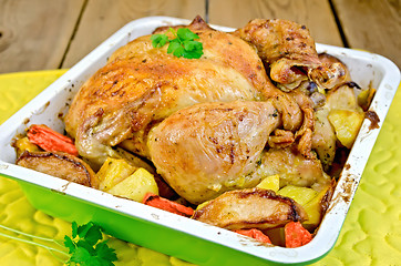 Image showing Chicken baked with vegetables in tray on board