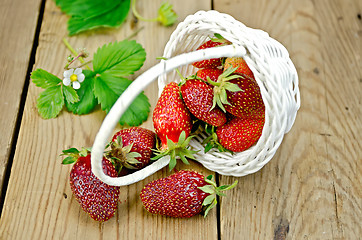 Image showing Strawberry poured out of basket on board