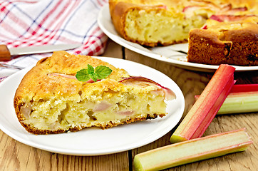 Image showing Pie with rhubarb and a knife on board