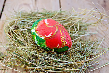 Image showing Easter egg with red flower on board