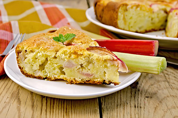 Image showing Pie with rhubarb and napkin on board