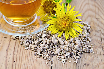 Image showing Herbal tea from the root of elecampane with cup and flower