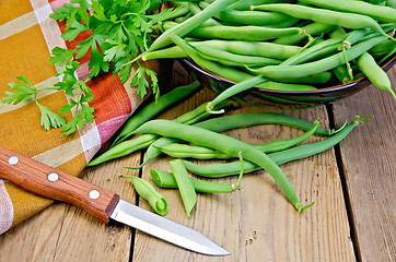 Image showing Beans green on board with knife and napkin