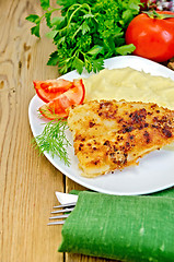 Image showing Fish fried with mashed potatoes and tomatoes