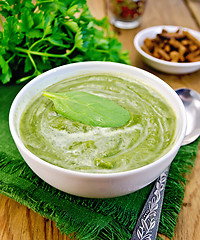 Image showing Puree green with spinach and spoon on board
