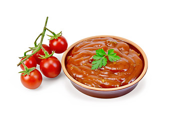 Image showing Ketchup in pottery with tomatoes