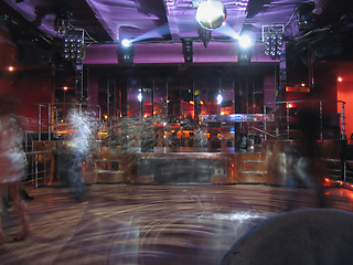 Image showing blurred silhouettes of people in the nightclub