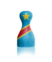 Image showing Wooden pawn with a painting of a flag